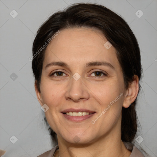 Joyful white adult female with medium  brown hair and brown eyes