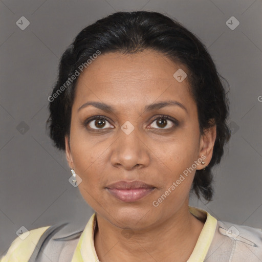 Joyful black adult female with short  brown hair and brown eyes