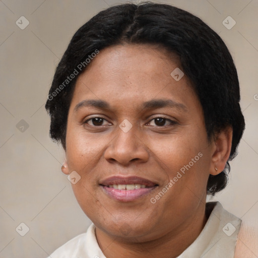 Joyful black adult female with short  brown hair and brown eyes