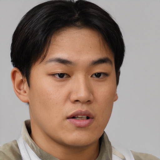 Neutral asian young-adult male with short  brown hair and brown eyes
