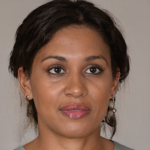Joyful black young-adult female with medium  brown hair and brown eyes
