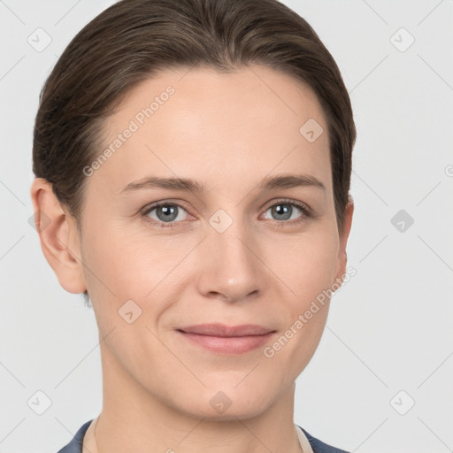 Joyful white young-adult female with short  brown hair and grey eyes