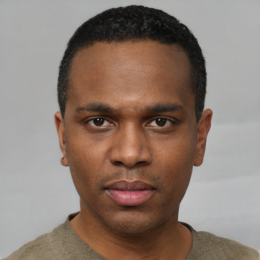 Neutral black young-adult male with short  black hair and brown eyes
