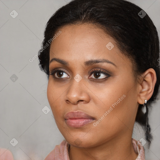 Joyful black young-adult female with medium  brown hair and brown eyes