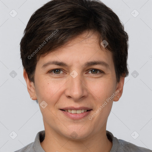 Joyful white young-adult female with short  brown hair and grey eyes