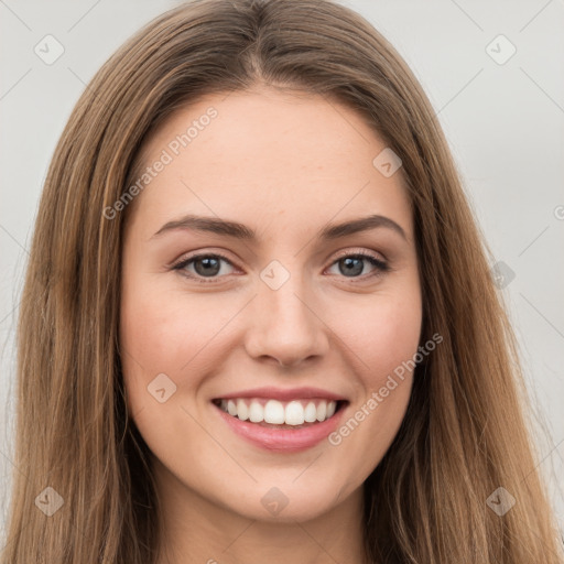 Joyful white young-adult female with long  brown hair and green eyes