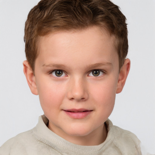 Joyful white child male with short  brown hair and brown eyes