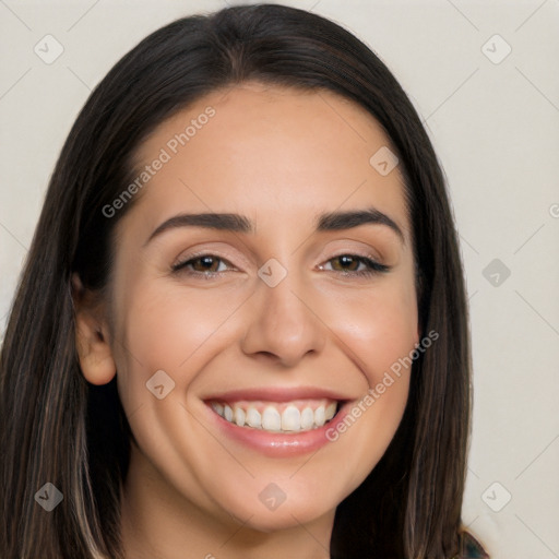 Joyful white young-adult female with long  black hair and brown eyes