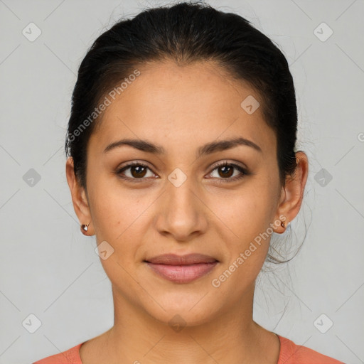 Joyful latino young-adult female with medium  brown hair and brown eyes