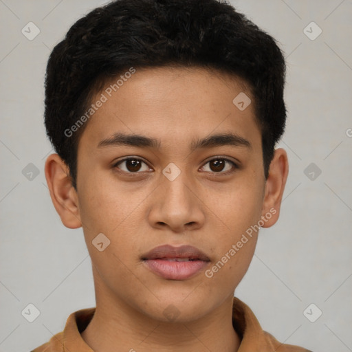 Joyful latino young-adult male with short  brown hair and brown eyes