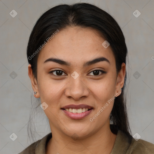 Joyful latino young-adult female with medium  brown hair and brown eyes