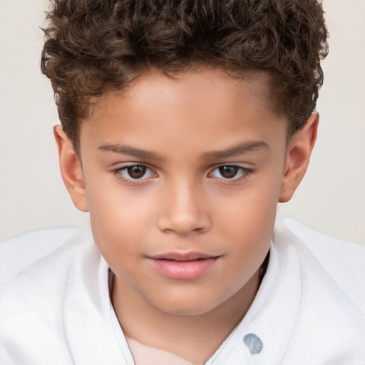 Joyful white child male with short  brown hair and brown eyes