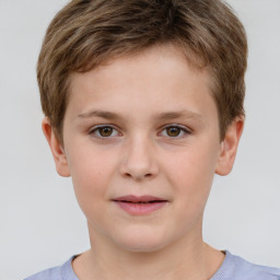 Joyful white child male with short  brown hair and brown eyes