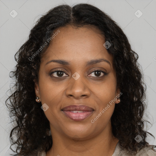 Joyful black young-adult female with long  brown hair and brown eyes