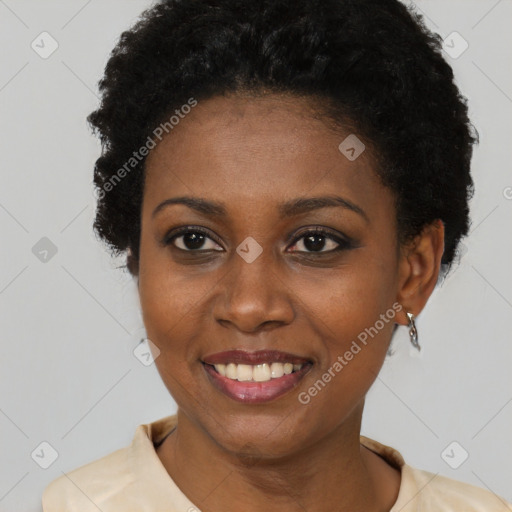 Joyful black young-adult female with short  black hair and brown eyes