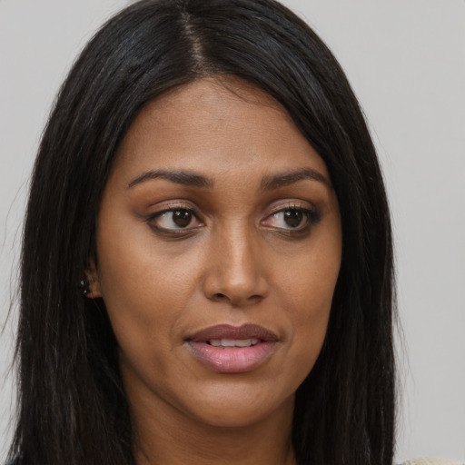 Joyful asian young-adult female with long  brown hair and brown eyes