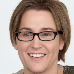 Joyful white adult female with medium  brown hair and blue eyes