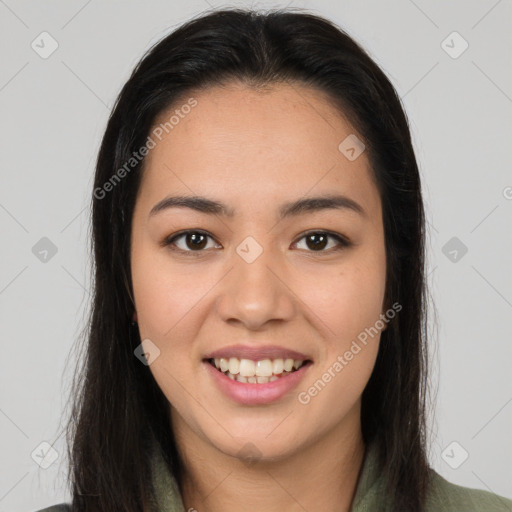 Joyful latino young-adult female with long  brown hair and brown eyes