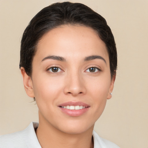 Joyful white young-adult female with short  brown hair and brown eyes