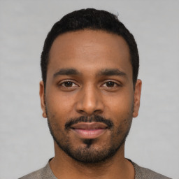 Neutral black young-adult male with short  black hair and brown eyes