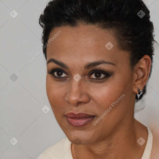 Joyful black young-adult female with short  black hair and brown eyes