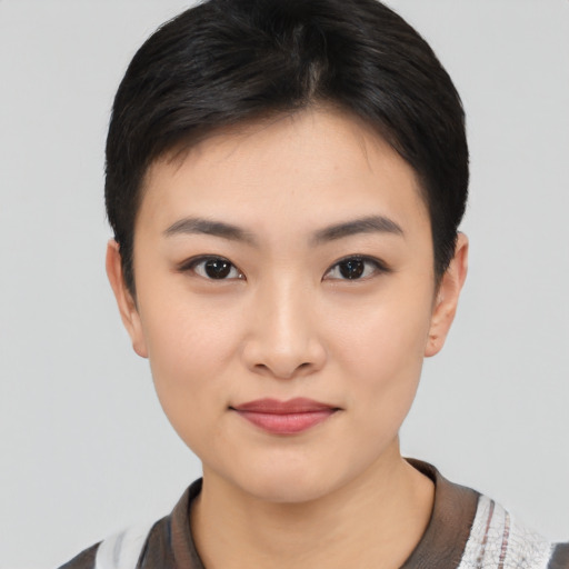 Joyful asian young-adult female with short  black hair and brown eyes