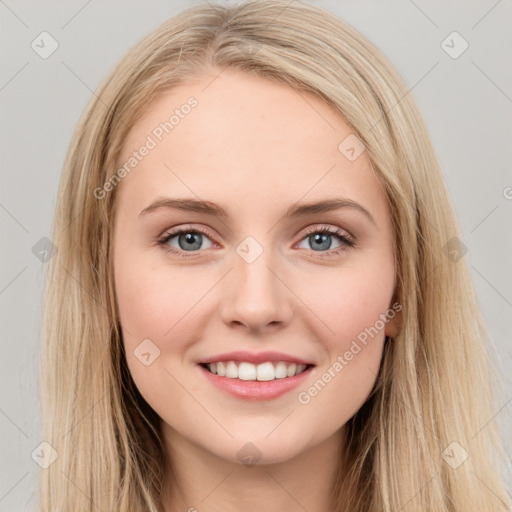 Joyful white young-adult female with long  brown hair and blue eyes