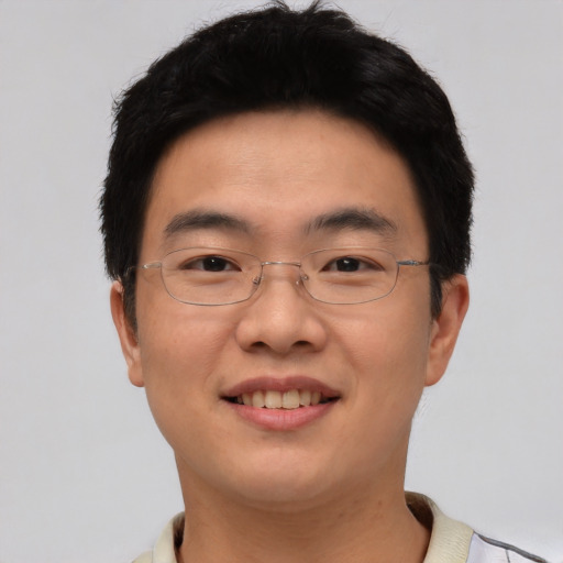Joyful white young-adult male with short  black hair and brown eyes