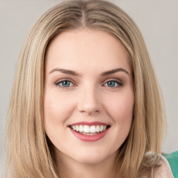 Joyful white young-adult female with long  brown hair and green eyes