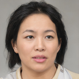 Neutral asian young-adult female with medium  brown hair and brown eyes