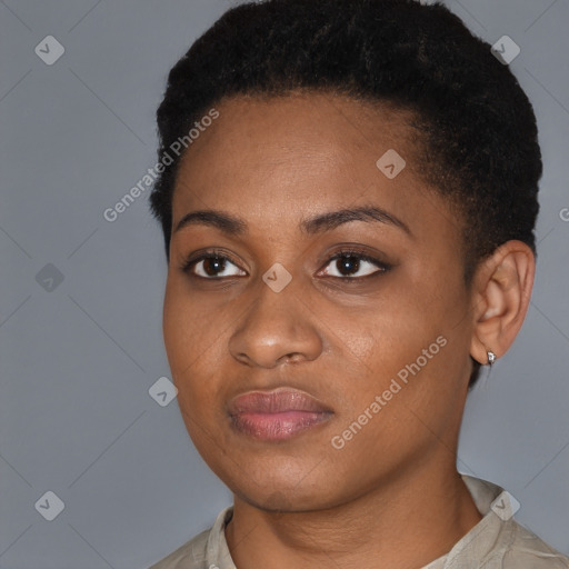 Joyful black young-adult female with short  black hair and brown eyes