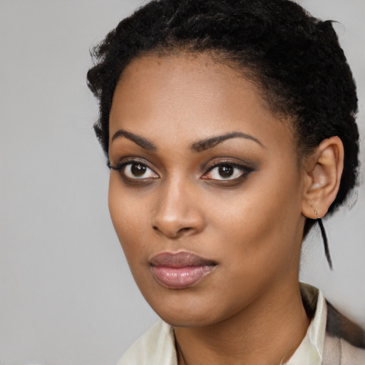 Joyful latino young-adult female with short  black hair and brown eyes