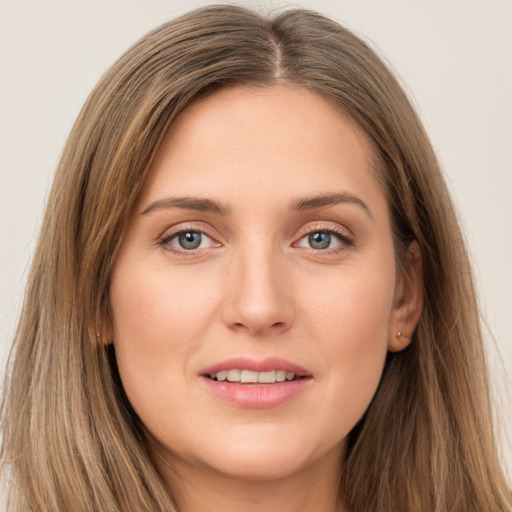 Joyful white young-adult female with long  brown hair and grey eyes