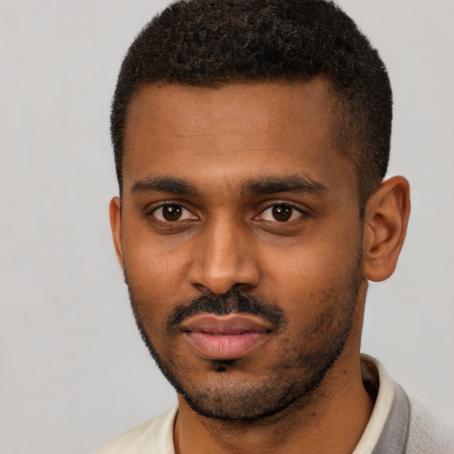 Neutral black young-adult male with short  black hair and brown eyes