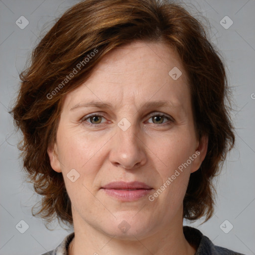 Joyful white adult female with medium  brown hair and grey eyes