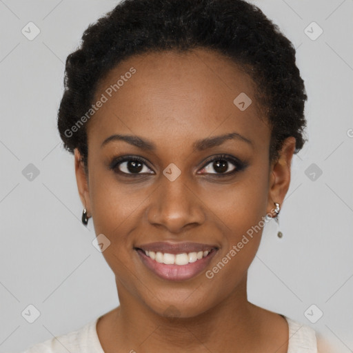 Joyful black young-adult female with short  black hair and brown eyes