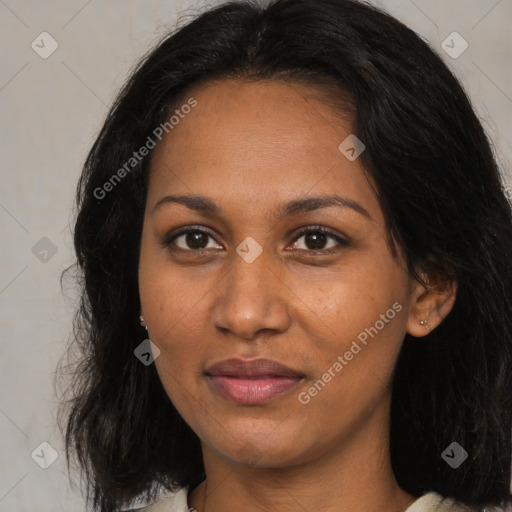 Joyful black adult female with medium  brown hair and brown eyes