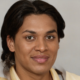 Joyful white adult female with medium  brown hair and brown eyes