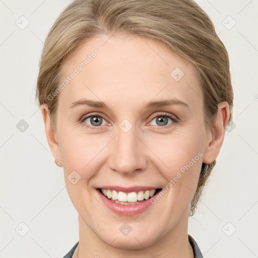 Joyful white young-adult female with medium  brown hair and blue eyes