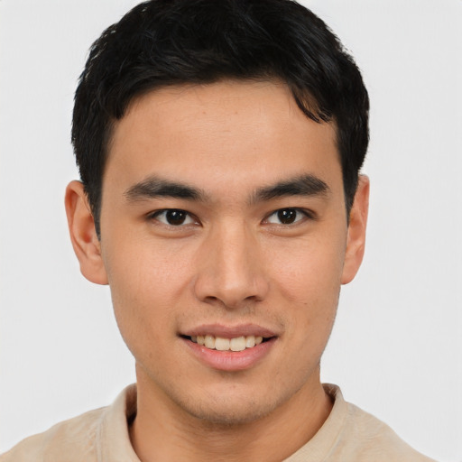 Joyful asian young-adult male with short  brown hair and brown eyes