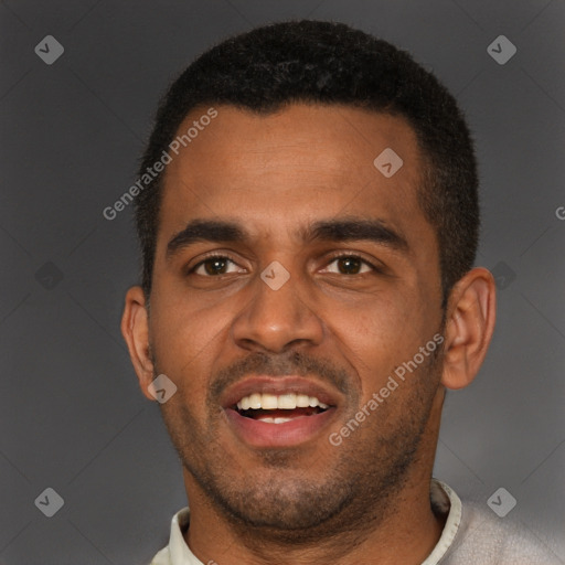 Joyful black young-adult male with short  brown hair and brown eyes