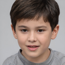 Joyful white child male with short  brown hair and brown eyes