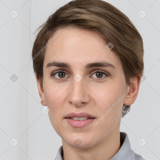 Joyful white young-adult female with short  brown hair and grey eyes