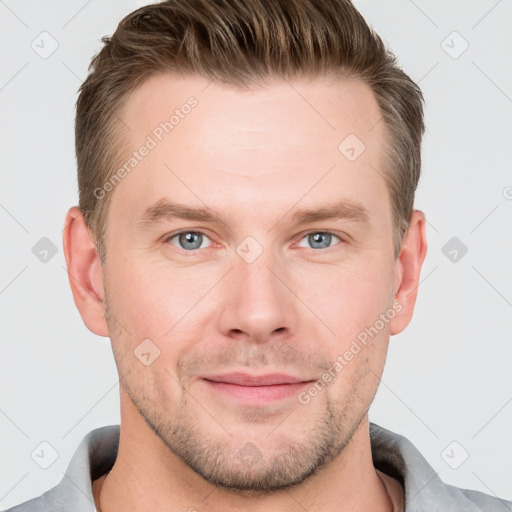 Joyful white young-adult male with short  brown hair and grey eyes