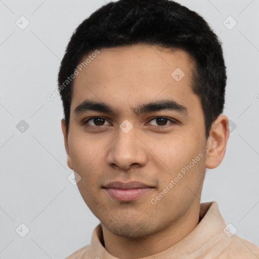 Joyful latino young-adult male with short  black hair and brown eyes