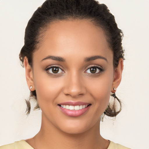 Joyful white young-adult female with medium  brown hair and brown eyes