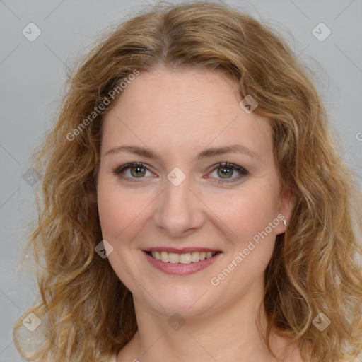 Joyful white young-adult female with medium  brown hair and green eyes