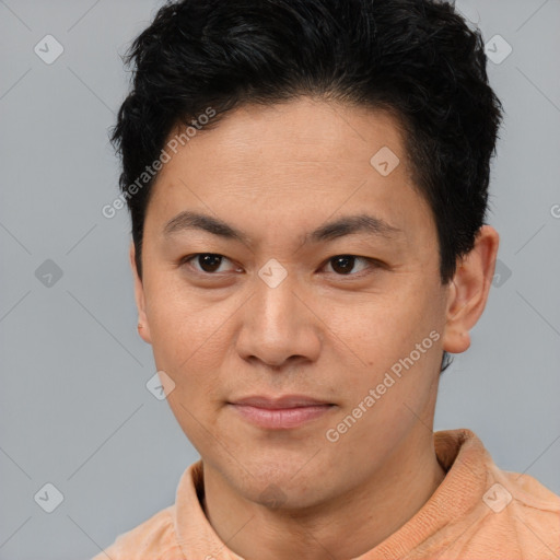 Joyful latino young-adult male with short  brown hair and brown eyes