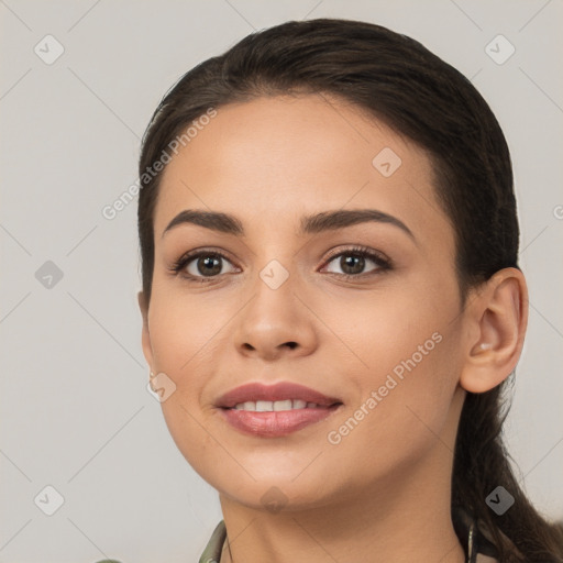 Joyful white young-adult female with long  brown hair and brown eyes