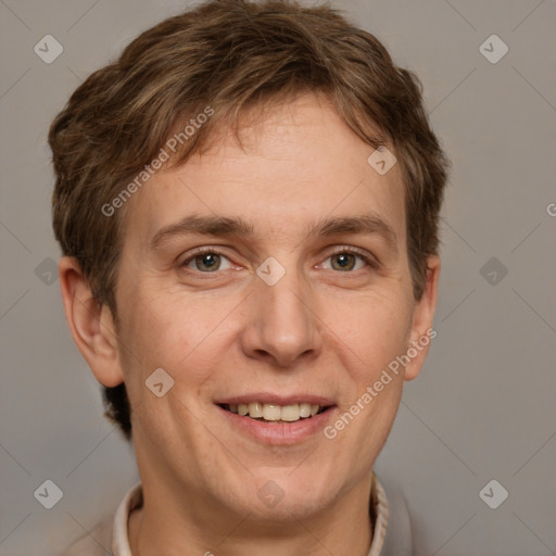 Joyful white adult male with short  brown hair and grey eyes